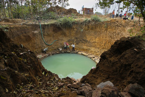 30-foot well under construction with pump station above.